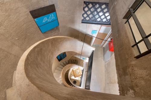 an overhead view of a spiral staircase in a building at Brondo Architect Hotel in Palma de Mallorca