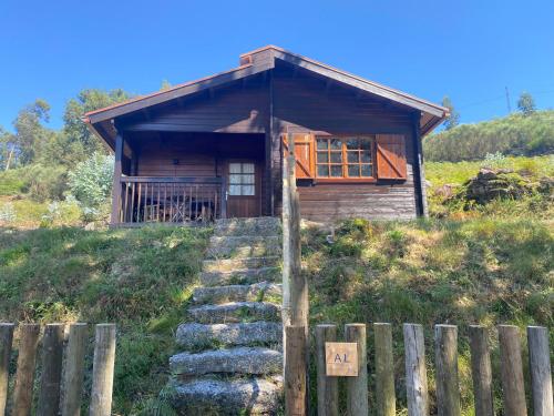 a house on a hill with stairs leading up to it at Cabaninha de Cabana Maior in Cabana Maior
