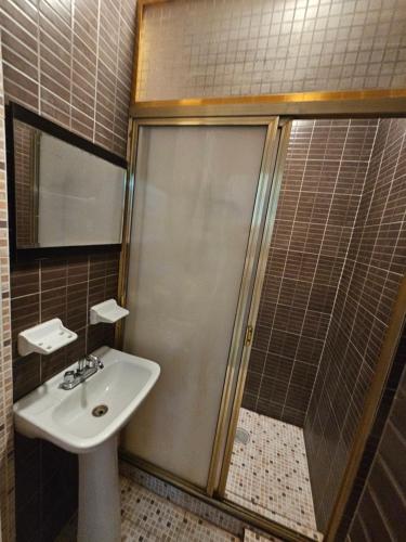 a bathroom with a sink and a shower at Casablanca Bonfil #1 in Acapulco