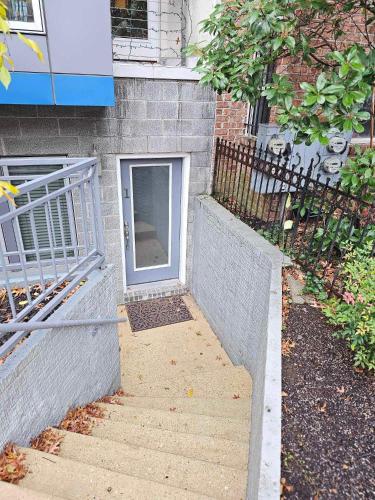 a door on the side of a building with stairs at Chic 2 bedroom condo at 2121 in Washington, D.C.