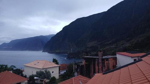 a view of a town with mountains and a body of water at Vivenda Silva in Seixal