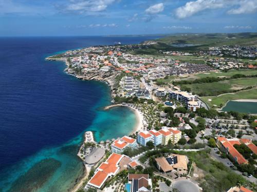 an aerial view of a resort next to the ocean at The Breeze Escape in Blue Bay