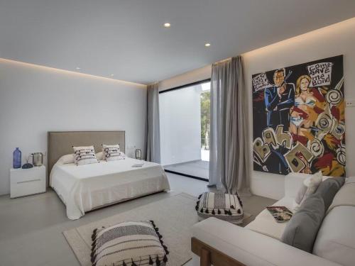 Ένα ή περισσότερα κρεβάτια σε δωμάτιο στο Villa in Ibiza with Stunning Sea Views