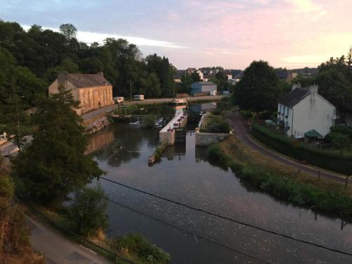 a view of a river with boats in it at Maison de charme, 14 personnes, vue sur le canal in Rohan