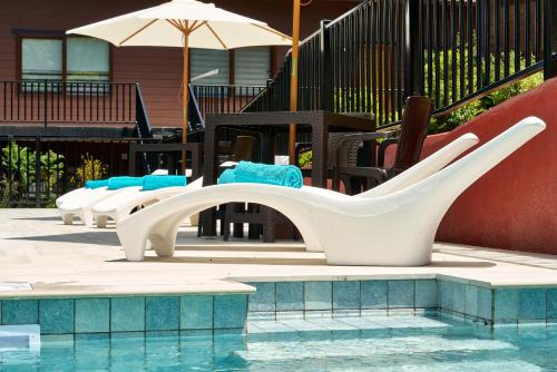 a swimming pool with a slide in the middle of it at mirabosque new aparments 4 in Osorno
