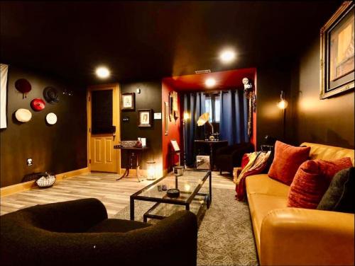 a living room with a couch and a table at Bloomingdale Blues Speakeasy Free Parking in Washington, D.C.