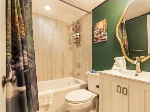 a bathroom with a toilet and a sink and a shower at Bloomingdale Blues Speakeasy Free Parking in Washington, D.C.
