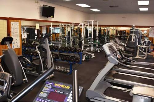 a gym with cardio equipment and tread machines at Waterville Wonderland in Thornton