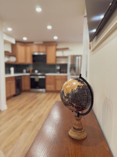 a globe sitting on top of a table in a kitchen at Elegant 3BR 2BA Entire Apartment Short Walk To The Beach Heart Of Wildwood in Wildwood