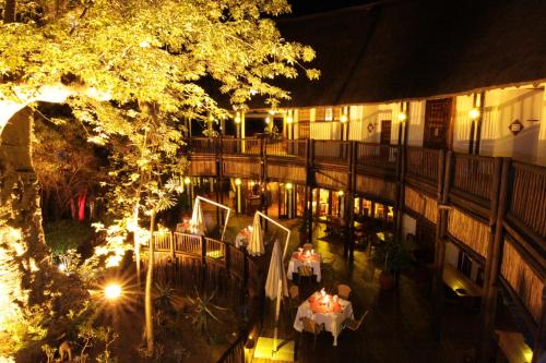 an overhead view of a restaurant at night with lights at Cresta Mowana Safari Resort & Spa in Kasane