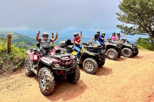 a group of people riding atvs on a dirt road at Apartamento en Guaduas 2 habitaciones 4 camas in Guaduas