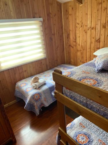 Postel nebo postele na pokoji v ubytování Cabaña jazmin