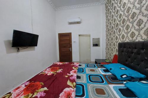 TV a/nebo společenská místnost v ubytování Hotel Mulia Tiza