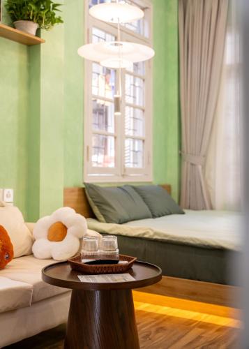 a living room with a couch and a table at Dechill House in Hanoi
