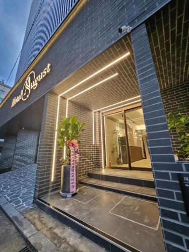 a store front with a vase in front of a building at Hwagok August in Seoul