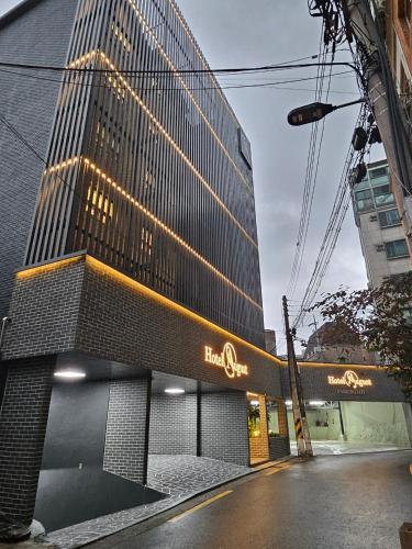 a tall building with a sign in front of it at Hwagok August in Seoul