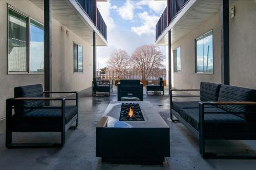 a living room with a fire pit in a building at Luxury Apartment in Downtown SLC in Salt Lake City