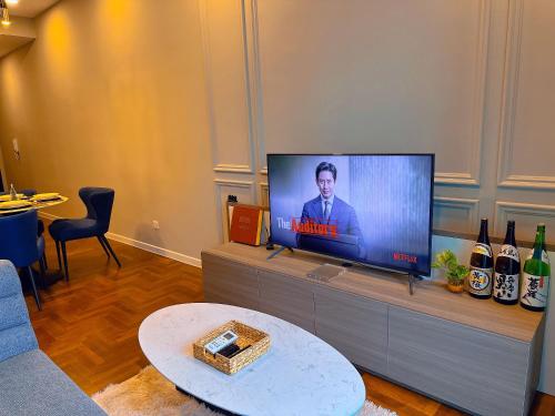 a living room with a flat screen tv at Bloomsvale Residence in Kuala Lumpur