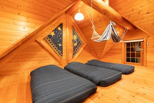 a room with three bean bags in a attic at SUGI BASE Biwako in Otsu