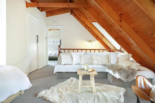 a living room with a couch and a table at Serenity 222 The Estate in Jervis Bay in St Georges Basin