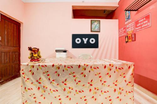 a table with a oro sign on top of it at Hotel O Abhilasha in Bhilai