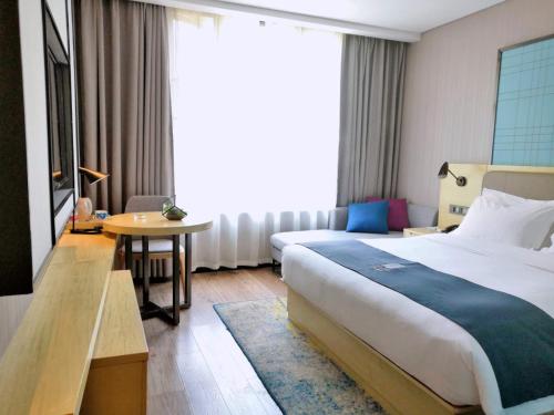 Katil atau katil-katil dalam bilik di Echarm Hotel Tongshan Niutoushan Park