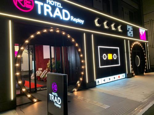 a sign for a theater with a sign for the road at HOTEL TRAD Replay in Osaka