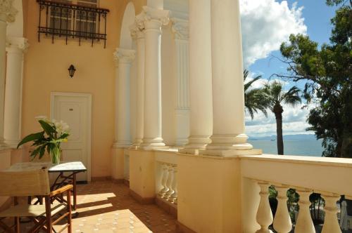 a balcony of a house with a view of the ocean at Villa Irlanda Grand Hotel in Gaeta