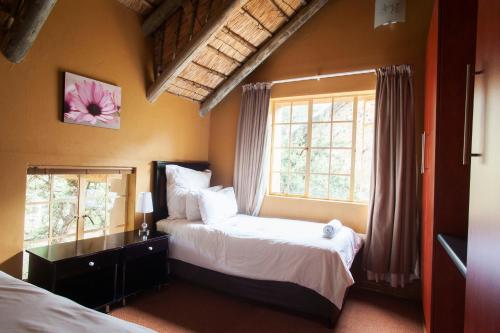 Voodi või voodid majutusasutuse Maliba River Lodge toas