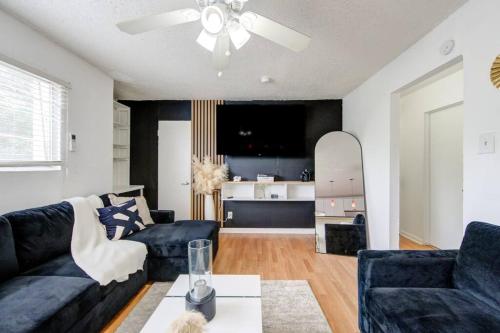 a living room with a couch and a table at 1 Bedroom Getaway in Houston in Houston