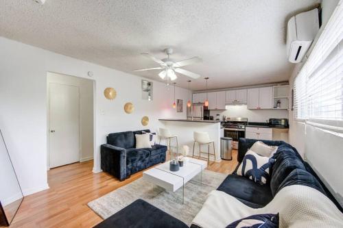 a living room with a couch and a table at 1 Bedroom Getaway in Houston in Houston