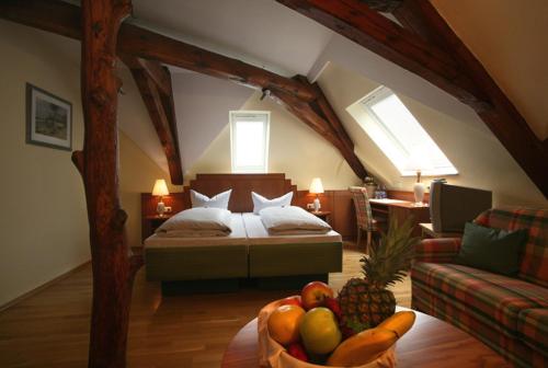 A bed or beds in a room at Goldener Adler