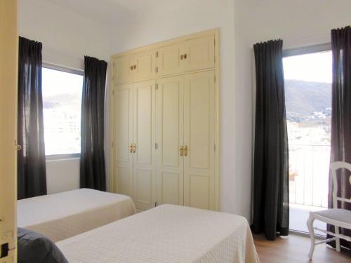 Katil atau katil-katil dalam bilik di Apartamentos Bruja