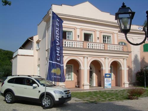a white car parked in front of a building at Villa Irlanda Grand Hotel in Gaeta