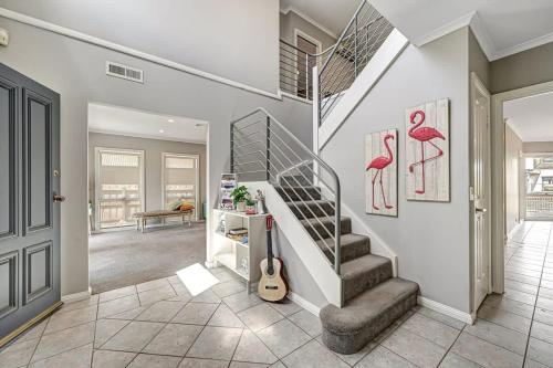 a staircase in a house with a guitar in a room at Jaw Dropping Waterside Getaway Patterson Lakes in Patterson Lakes