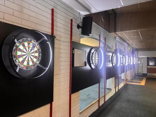 a dart board on the wall of a room at The Club Hotel Collie in Collie