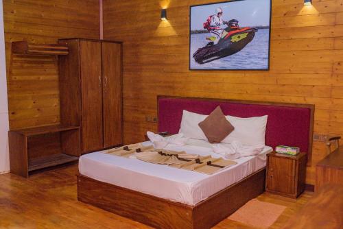 a bedroom with a bed in a room at New Saniro Lagoon Deck in Katunayaka