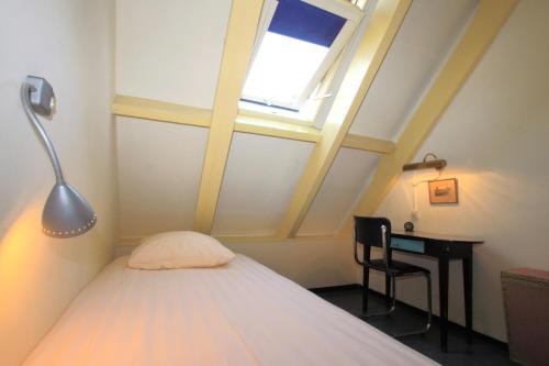 Katil atau katil-katil dalam bilik di Hotel Museumzicht
