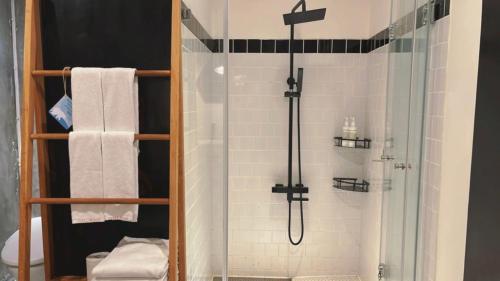 a bathroom with a shower with a glass shower at Chill Roof Hotel in Taipei