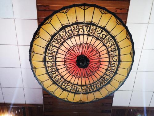 a stained glass ceiling in a restaurant at Ruby True Hotel in Bagan