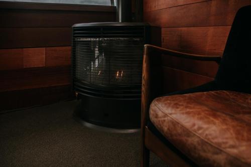 a heater in a room with a fire in it at Eagle View Escape in Rydal