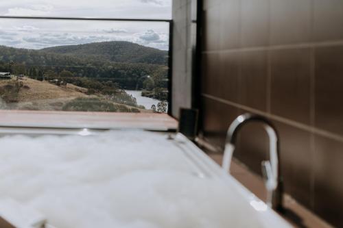 a view of a river from a window at Eagle View Escape in Rydal