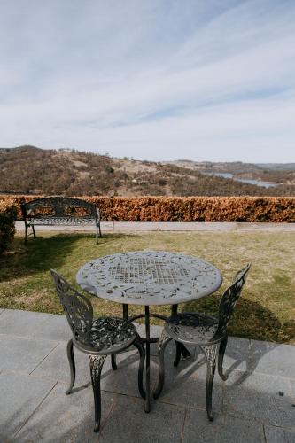 a table and two chairs sitting next to a table at Eagle View Escape in Rydal