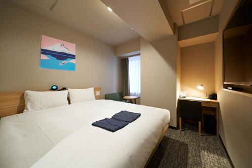 Postel nebo postele na pokoji v ubytování HOTEL Enmichi