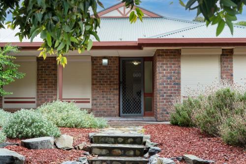 a home with a brick house with a front door at Relaxing Holiday Home Pets Are Welcome in Victor Harbor