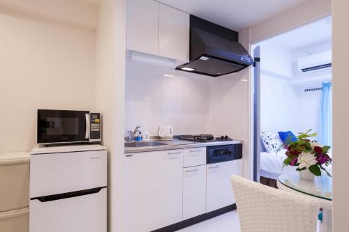 Virtuve vai virtuves zona naktsmītnē Living Inn Asahibashiekimae Anex
