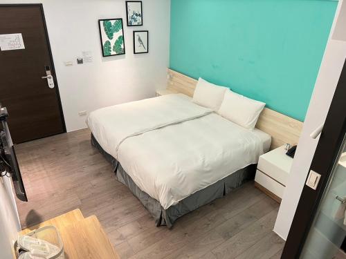 Postel nebo postele na pokoji v ubytování Greenight Hotel