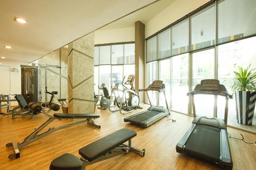 a gym with many exercise equipment in a room at Dcondo campus resort Bangsaen in Ban Rong Khoei