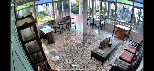 an aerial view of a room with tables and chairs at Baan Debtida in Bangkok