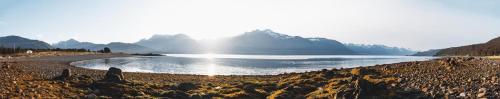 a view of a lake with mountains in the background at Cabin 2 Lynn View Lodge in Haines